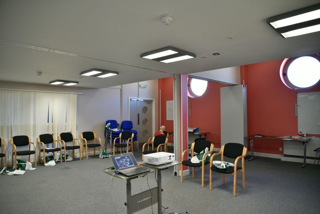 A Ripple Centre training room set up for first aid training. There are dividers, which show how the space could be partitioned into two rooms.